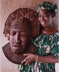 Mrs. Adebola Isola Holding a Mask Carved by Lamidi Fakeye - Ile-Ife, Nigeria