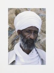 Man in White Head covering and Clothes